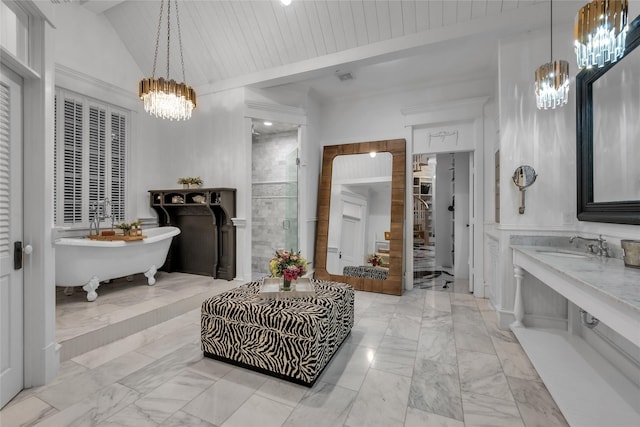 417 Windwood Ct, Mckinney, TX 75071 - bathroom featuring a chandelier, marble finish floors, a shower stall, a freestanding tub, and vanity