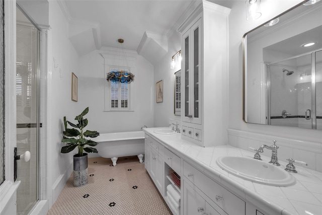 417 Windwood Ct, Mckinney, TX 75071 - full bathroom featuring a stall shower, a freestanding bath, double vanity, ornamental molding, and tile patterned flooring