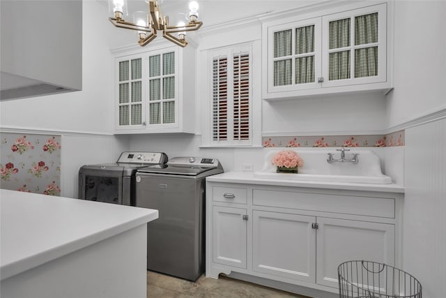 417 Windwood Ct, Mckinney, TX 75071 - laundry area featuring separate washer and dryer, a chandelier, and cabinet space