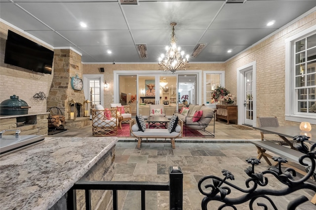 417 Windwood Ct, Mckinney, TX 75071 - view of patio / terrace with area for grilling and an outdoor living space with a fireplace
