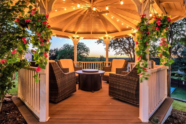 417 Windwood Ct, Mckinney, TX 75071 - deck at dusk featuring a gazebo and an outdoor hangout area