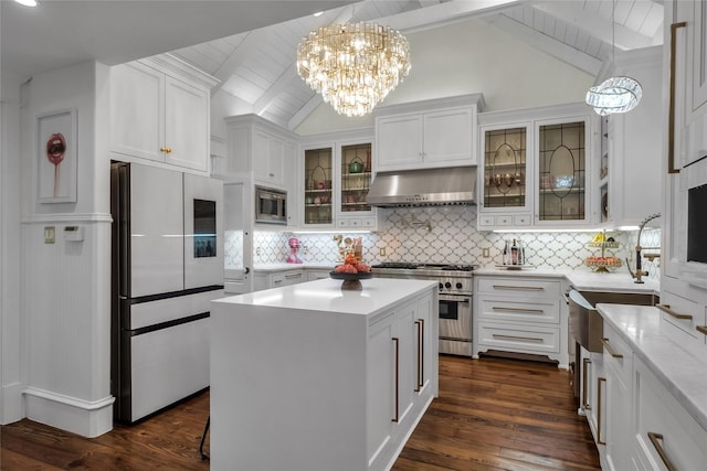 417 Windwood Ct, Mckinney, TX 75071 - kitchen with extractor fan, appliances with stainless steel finishes, dark wood-type flooring, a chandelier, and white cabinets