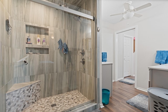 2521 Trail Tree Ct, Burleson, TX 76028 - bathroom with a stall shower, a ceiling fan, wood finished floors, vanity, and baseboards