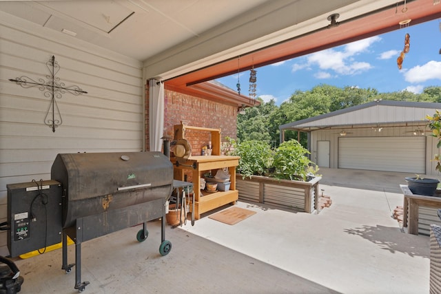 2521 Trail Tree Ct, Burleson, TX 76028 - view of patio with a grill and a detached garage