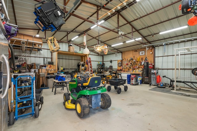 2521 Trail Tree Ct, Burleson, TX 76028 - garage featuring metal wall, a workshop area, and a garage door opener