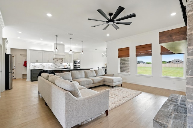 120 Crosswind Trl, Ovalo, TX 79541 - living area featuring a ceiling fan, ornamental molding, light wood-type flooring, recessed lighting, and baseboards