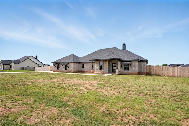 120 Crosswind Trl, Ovalo, TX 79541 - view of front facade featuring brick siding, a patio, and a chimney