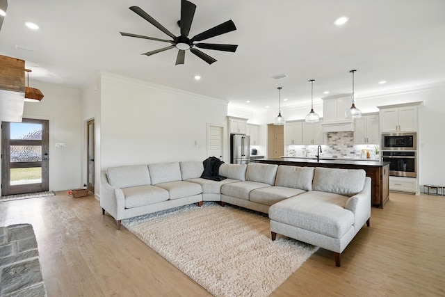 120 Crosswind Trl, Ovalo, TX 79541 - living room with ceiling fan, light wood-type flooring, ornamental molding, and recessed lighting