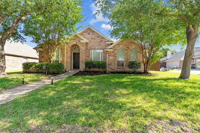 1060 Knightsbridge Dr, Frisco, TX 75036 - traditional home featuring brick siding and a front yard