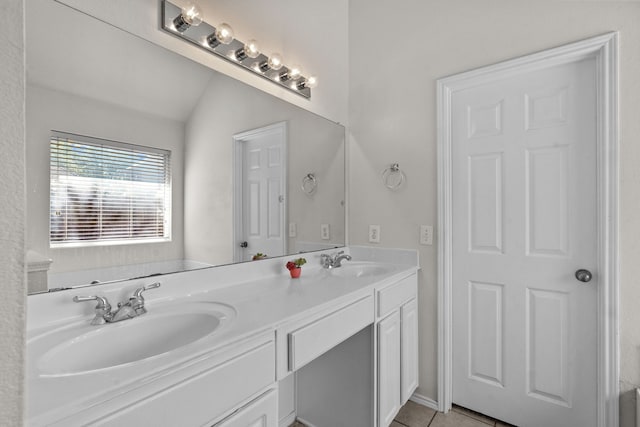 1060 Knightsbridge Dr, Frisco, TX 75036 - bathroom with double vanity, lofted ceiling, and tile patterned floors