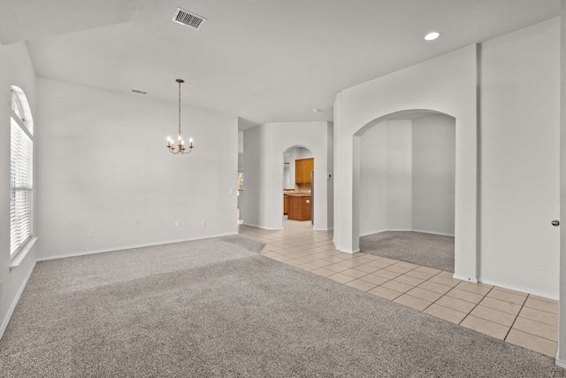 1060 Knightsbridge Dr, Frisco, TX 75036 - empty room featuring arched walkways, light colored carpet, light tile patterned flooring, a chandelier, and recessed lighting