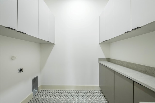 4435 Merrell Rd, Dallas, TX 75229 - laundry area featuring hookup for an electric dryer and cabinet space