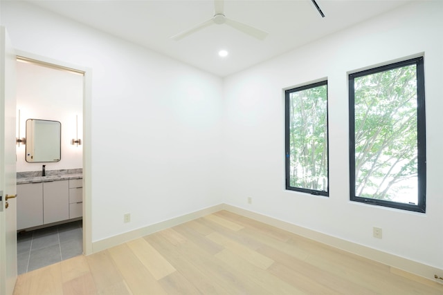 4435 Merrell Rd, Dallas, TX 75229 - empty room with light wood-style flooring, ceiling fan, and recessed lighting