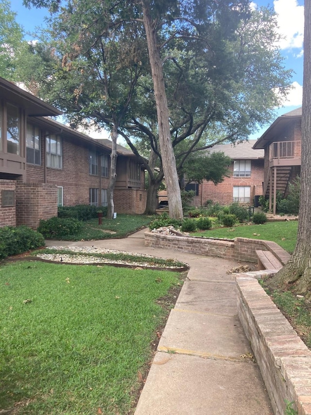 10534 Stone Canyon Rd Unit 111, Dallas, TX 75230 - view of grassy yard featuring stairs