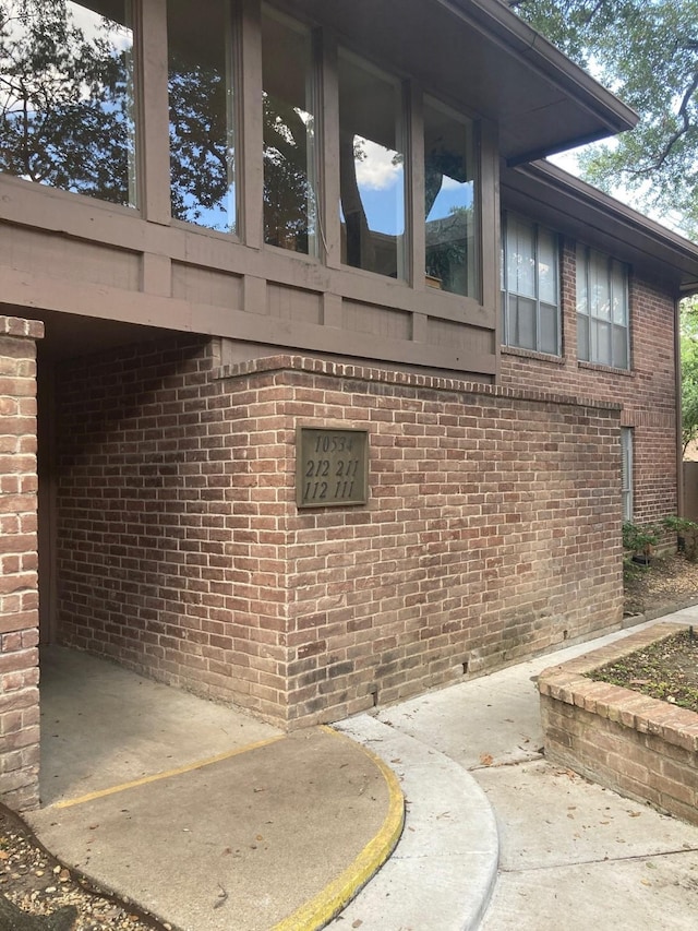 10534 Stone Canyon Rd Unit 111, Dallas, TX 75230 - view of side of property featuring brick siding