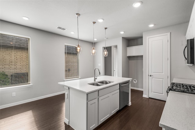2545 Stella Ln, Northlake, TX 76247 - kitchen with a sink, stainless steel dishwasher, black microwave, dark wood-type flooring, and white cabinetry