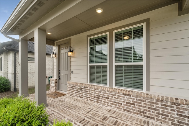 2545 Stella Ln, Northlake, TX 76247 - view of exterior entry featuring covered porch and brick siding