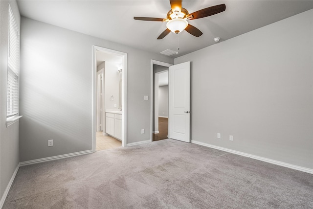 2545 Stella Ln, Northlake, TX 76247 - unfurnished bedroom with light colored carpet, baseboards, ensuite bathroom, and a ceiling fan