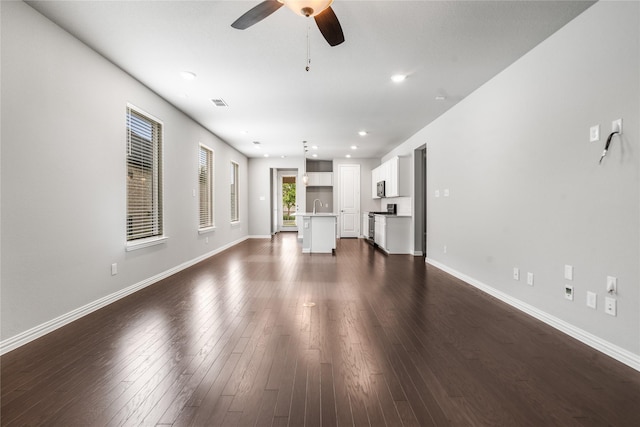 2545 Stella Ln, Northlake, TX 76247 - unfurnished living room with a ceiling fan, dark wood-type flooring, baseboards, a sink, and recessed lighting