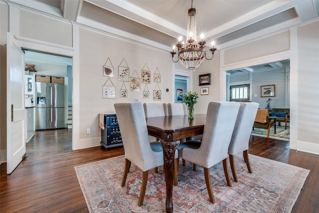 5206 Victor St, Dallas, TX 75214 - dining area with a chandelier, dark wood-style flooring, baseboards, and ornamental molding