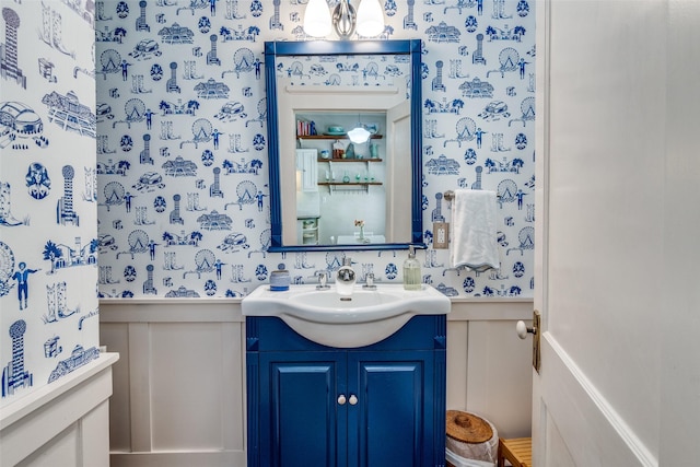 5206 Victor St, Dallas, TX 75214 - bathroom with a wainscoted wall, a decorative wall, wallpapered walls, and vanity