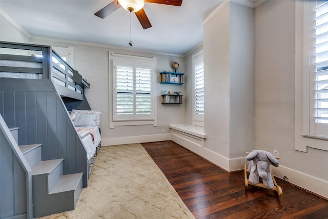 5206 Victor St, Dallas, TX 75214 - bedroom with multiple windows, wood finished floors, crown molding, and baseboards