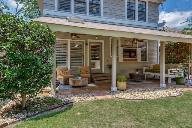 5206 Victor St, Dallas, TX 75214 - view of exterior entry with a ceiling fan, an outdoor living space, a patio area, and a lawn