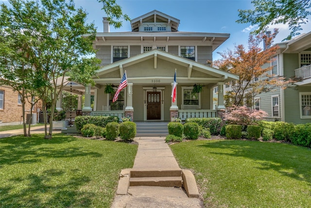 5206 Victor St, Dallas, TX 75214 - american foursquare style home featuring covered porch, a front yard, and a chimney