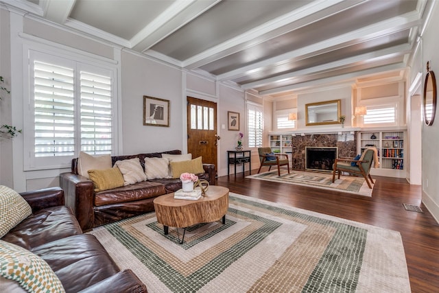 5206 Victor St, Dallas, TX 75214 - living area with wood finished floors, beamed ceiling, a premium fireplace, and crown molding