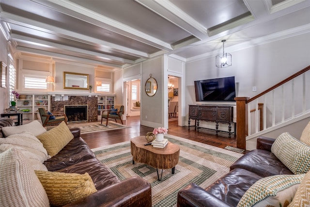 5206 Victor St, Dallas, TX 75214 - living area with beamed ceiling, wood finished floors, a high end fireplace, ornamental molding, and stairs