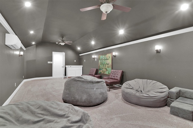 home theater room with a ceiling fan, a wall mounted air conditioner, carpet floors, lofted ceiling, and baseboards