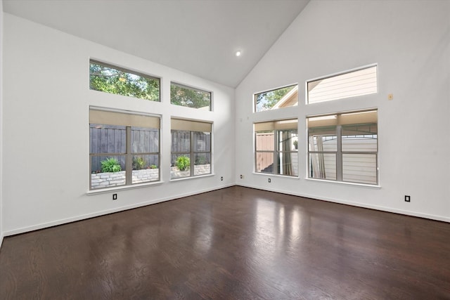 2544 Wedglea Dr, Dallas, TX 75211 - empty room with high vaulted ceiling, dark wood-style flooring, baseboards, and recessed lighting