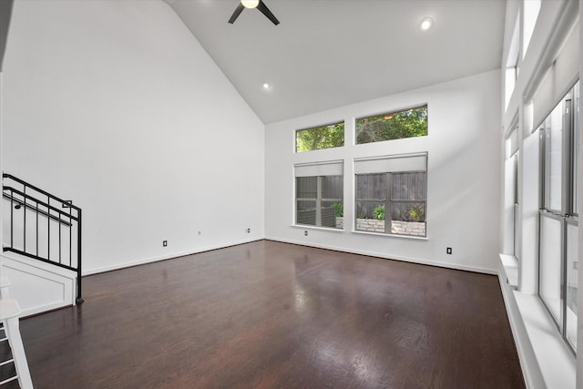 2544 Wedglea Dr, Dallas, TX 75211 - unfurnished living room with high vaulted ceiling, wood finished floors, stairs, a ceiling fan, and baseboards
