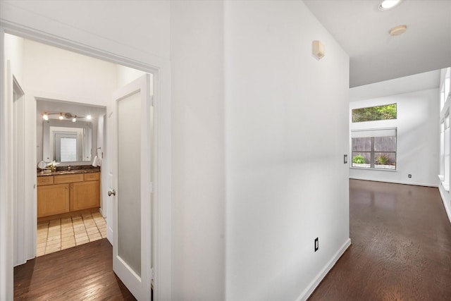 2544 Wedglea Dr, Dallas, TX 75211 - corridor featuring baseboards and dark wood-type flooring