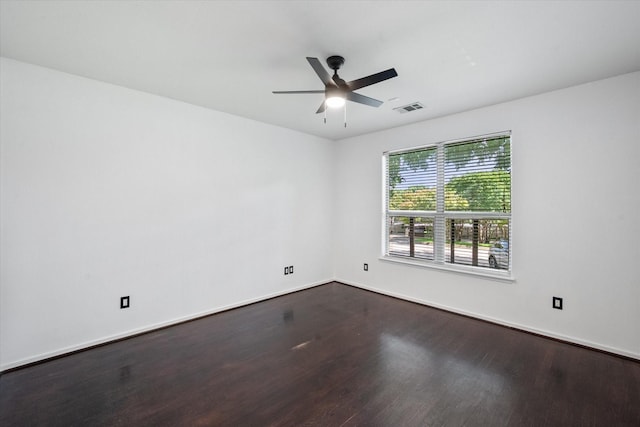 2544 Wedglea Dr, Dallas, TX 75211 - spare room featuring dark wood-style floors, ceiling fan, and baseboards