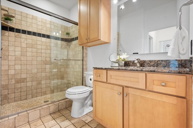 2544 Wedglea Dr, Dallas, TX 75211 - bathroom with a shower stall, toilet, and vanity