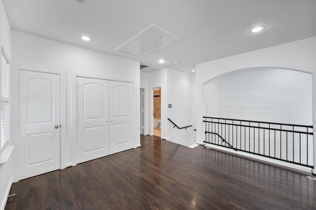 2544 Wedglea Dr, Dallas, TX 75211 - spare room with attic access, wood finished floors, recessed lighting, and arched walkways