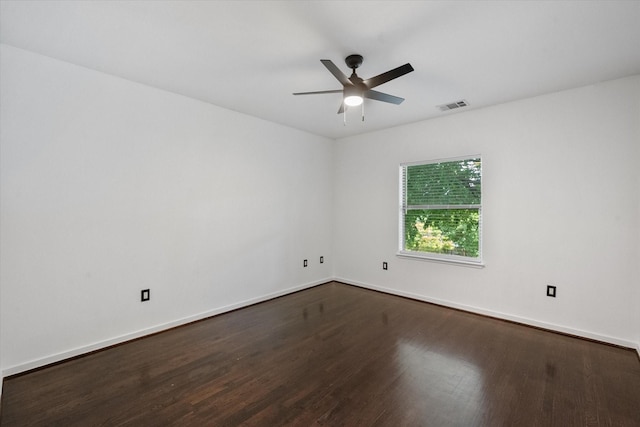 2544 Wedglea Dr, Dallas, TX 75211 - empty room with dark wood-type flooring, ceiling fan, and baseboards