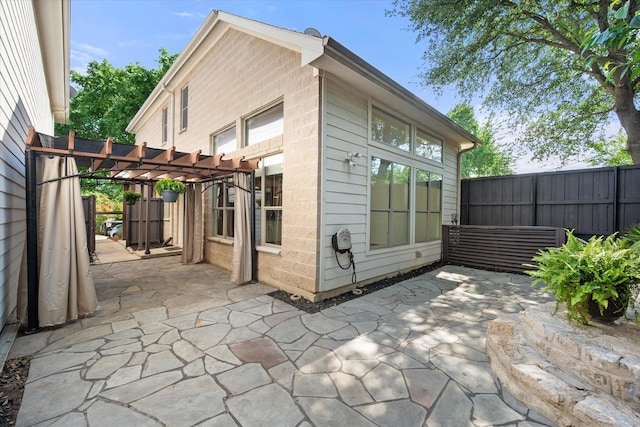 2544 Wedglea Dr, Dallas, TX 75211 - view of outbuilding with a pergola and fence