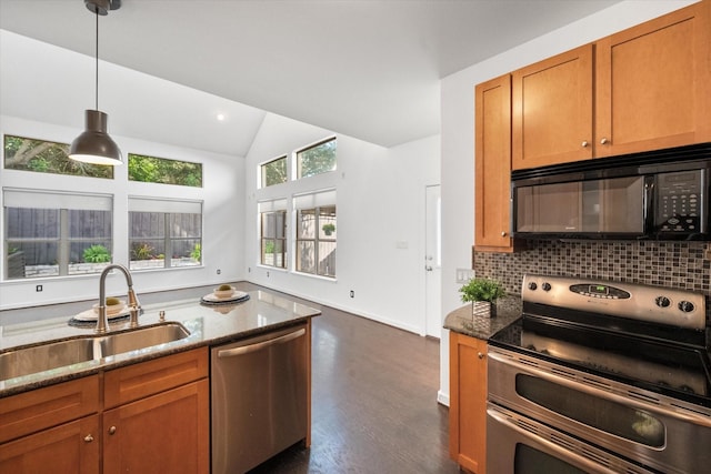 2544 Wedglea Dr, Dallas, TX 75211 - kitchen with appliances with stainless steel finishes, a sink, lofted ceiling, dark stone counters, and brown cabinets
