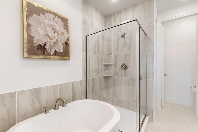 1033 Falls Rush Way, Royse City, TX 75189 - bathroom featuring a stall shower, a freestanding bath, and tile patterned flooring