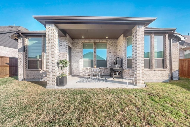 1033 Falls Rush Way, Royse City, TX 75189 - rear view of property with brick siding and a patio area