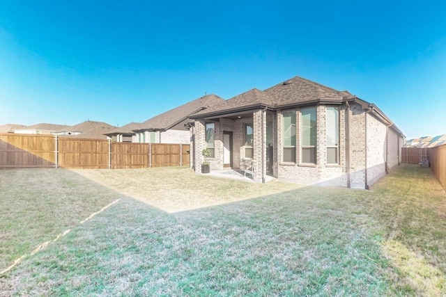 1033 Falls Rush Way, Royse City, TX 75189 - rear view of property with brick siding and a patio area