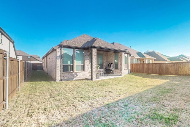 1033 Falls Rush Way, Royse City, TX 75189 - rear view of house with brick siding, a patio, and roof with shingles