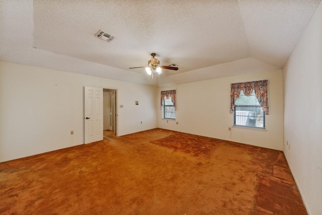 1300 Woodland Trail Dr, Bowie, TX 76230 - spare room with carpet flooring, ceiling fan, a textured ceiling, and vaulted ceiling