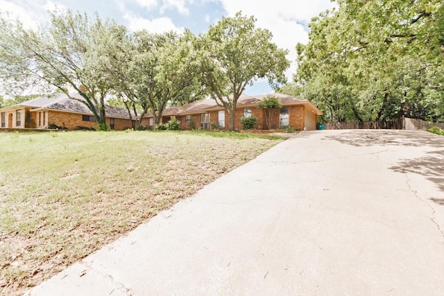 1300 Woodland Trail Dr, Bowie, TX 76230 - view of yard featuring concrete driveway