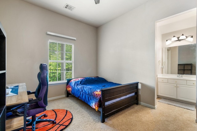 2048 Remington Ln, Frisco, TX 75033 - bedroom featuring light colored carpet, ensuite bath, baseboards, and a desk