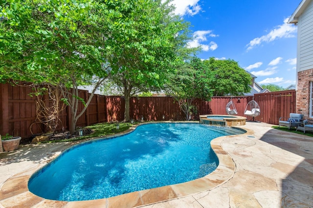 2048 Remington Ln, Frisco, TX 75033 - view of swimming pool featuring a patio area, a fenced backyard, and a pool with connected hot tub