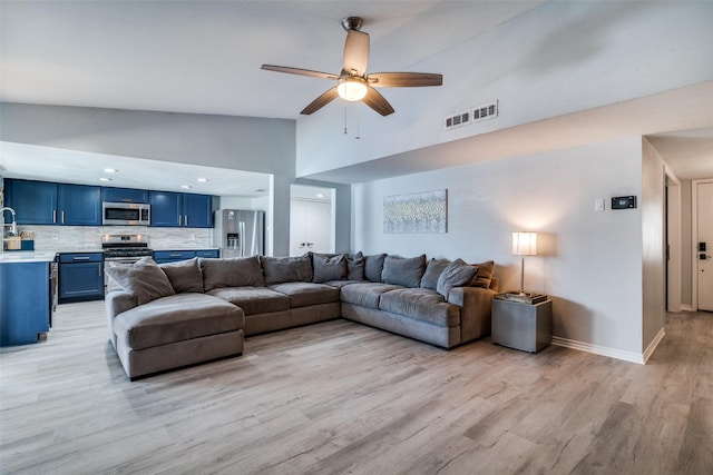 1301 Windy Meadow Dr, Plano, TX 75023 - living area featuring high vaulted ceiling, light wood-style flooring, ceiling fan, and baseboards