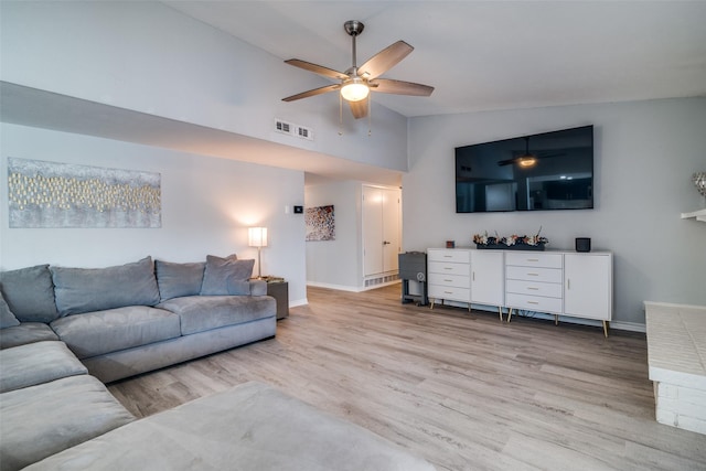 1301 Windy Meadow Dr, Plano, TX 75023 - living area featuring a ceiling fan, light wood-style flooring, baseboards, and high vaulted ceiling